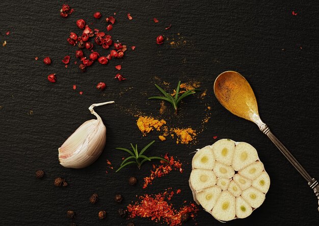 Oriental spices on a black stone background