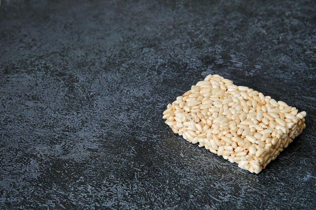 Oriental sweets on a light plate Sunflower halva sunflower gozinak Copy space