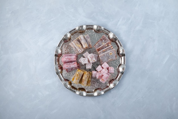 Oriental sweets Turkish delight with powdered sugar Assortment of Tasty Turkish delights