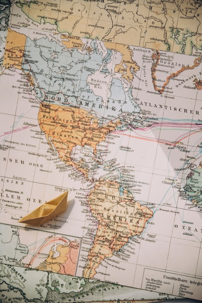 Photo origami boat on maps
