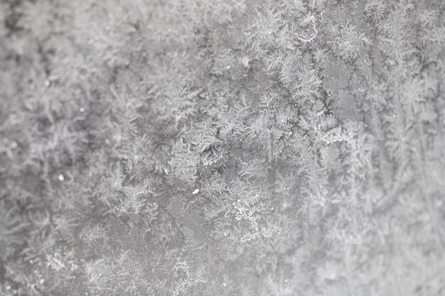 original background with a pattern painted by frost on the window glass