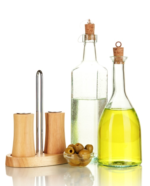 Original glass bottles with salad dressing isolated on white