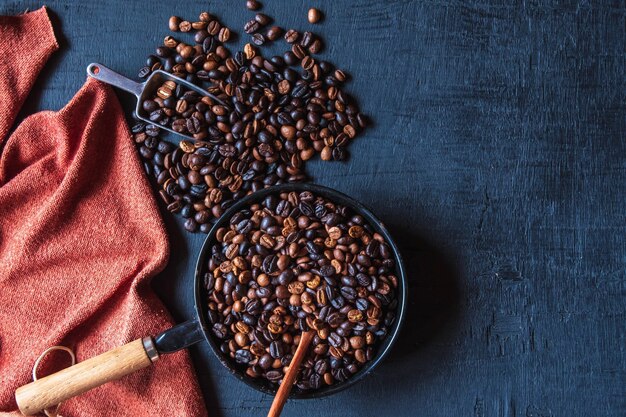 Original roasted coffee beans in a pan