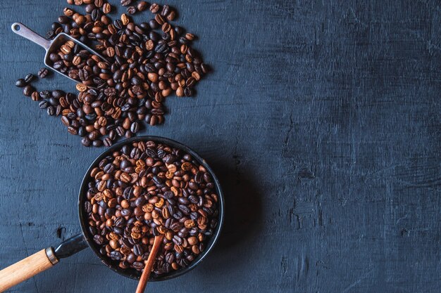 Original roasted coffee beans in a pan