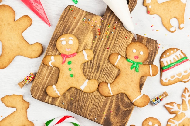 Ornament icing of Christmas gingerbreads on a white surface