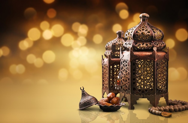 Ornamental Arabic lanterns on the desk on bokeh background