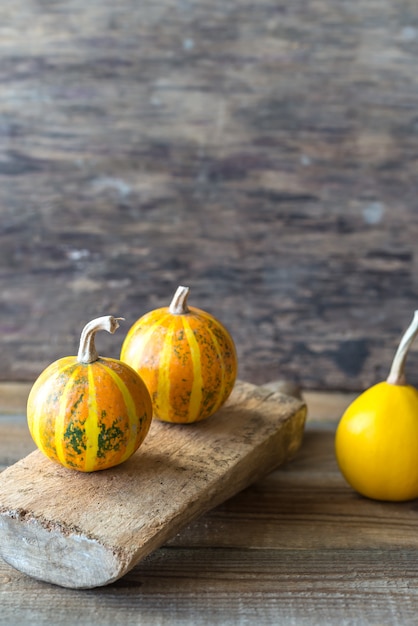 Ornamental pumpkins on wooden table