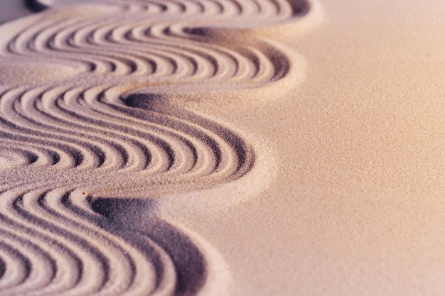 Ornamenten op zand in Japanse zen-tuin, achtergrond