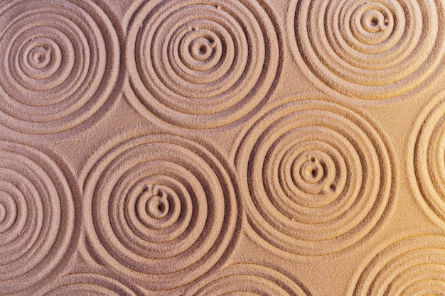 Ornaments on sand in japanese zen garden,