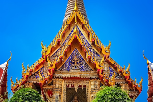 Ornate golden triangular roof of a Buddhist temple