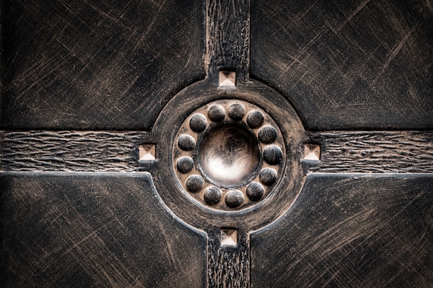 Ornate wrought-iron elements of metal gate decoration.