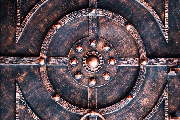 Ornate wrought-iron elements of metal gate decoration.