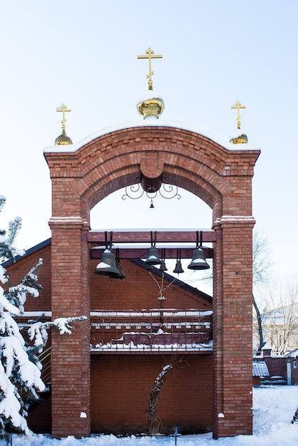 Православная колокольня зимой в России