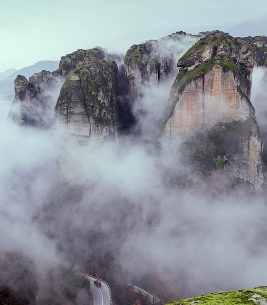 Orthodox monasteries of Meteora Greece on the rocks shrouded in fog