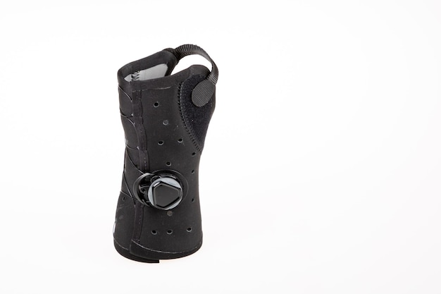 Orthosis black to place on hand over white background