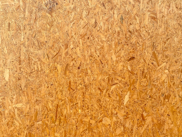 OSB brown wood texture wall background.