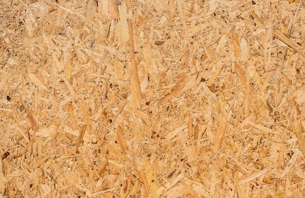 Osb sheet is made of brown wood chips pressed together into a wooden floor.