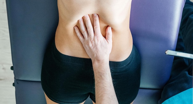 Osteopath performing diaphragm coastal release with his hand