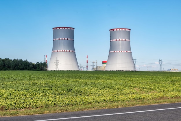 OSTROVEC BELARUS JULY 2020 Cooling towers of nuclear power plant against the blue sky