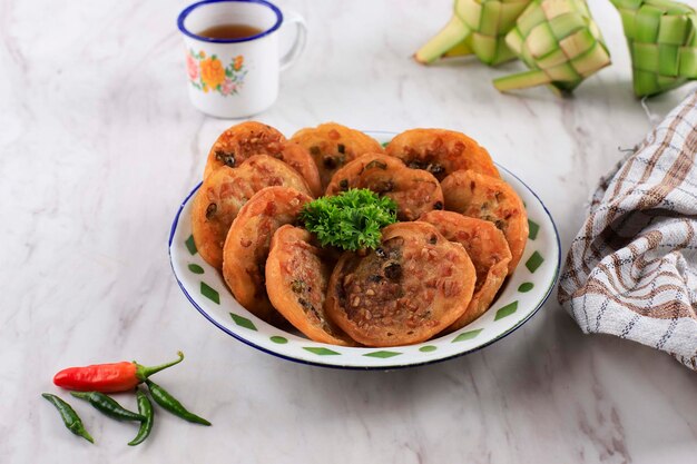 Ote-ote or Bala-bala, Homemade Vegetable Fritter Served on an Enamel Plate with Chilli and Tea