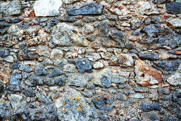 Oud bakstenen muurpatroon Middeleeuwse stenen muur Achtergrondtextuur