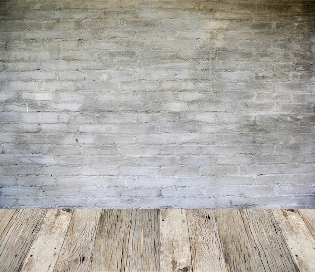 Oude betonnen muur en houten vloer achtergrond