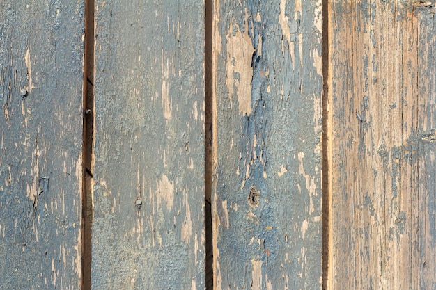 Oude blauwe houten achtergrond met afbladderende verf.