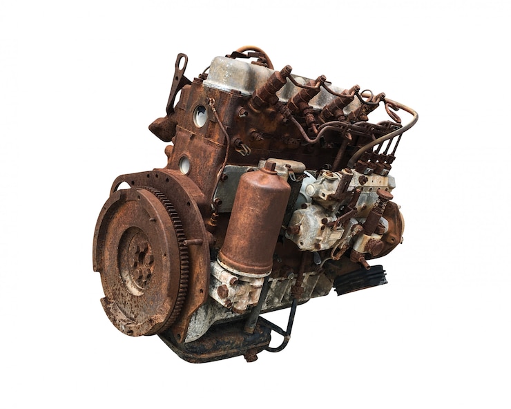 Foto oude geïsoleerde motor van een auto. roestige auto-motor.