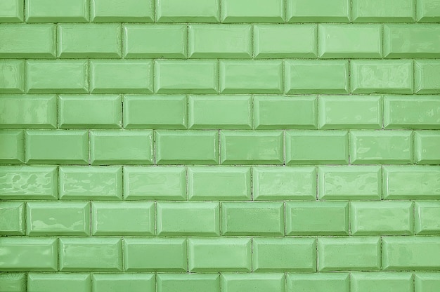 Oude groene van de tegelbakstenen muur textuur als achtergrond