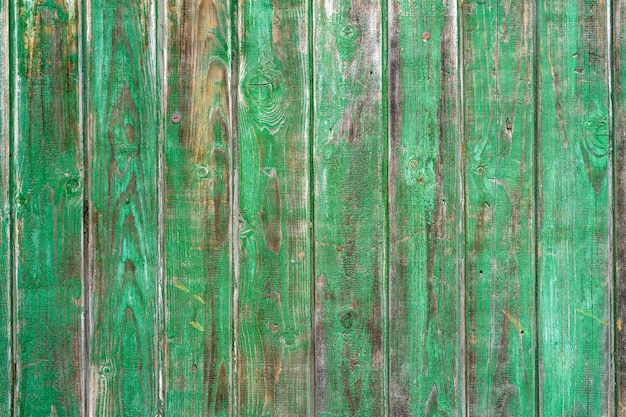 Oude houten vintage planken bedekt met schilferige groene verf. Hout textuur.