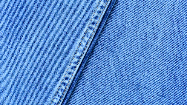 Oude lichtblauw van de textuur van naadden denim jean