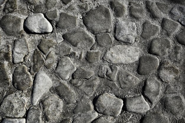 Oude stenen bestrating achtergrond / abstracte bestrating, grote kasseien, oude wegtextuur