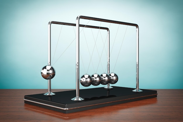 Oude stijl foto. Perpetual Motion Spheres van Newton op tafel