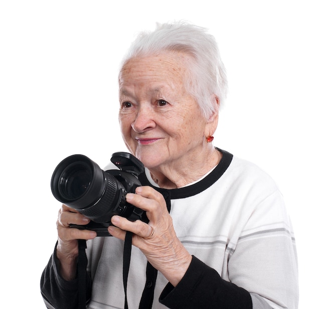 Oude vrouw met geïsoleerde fotocamera