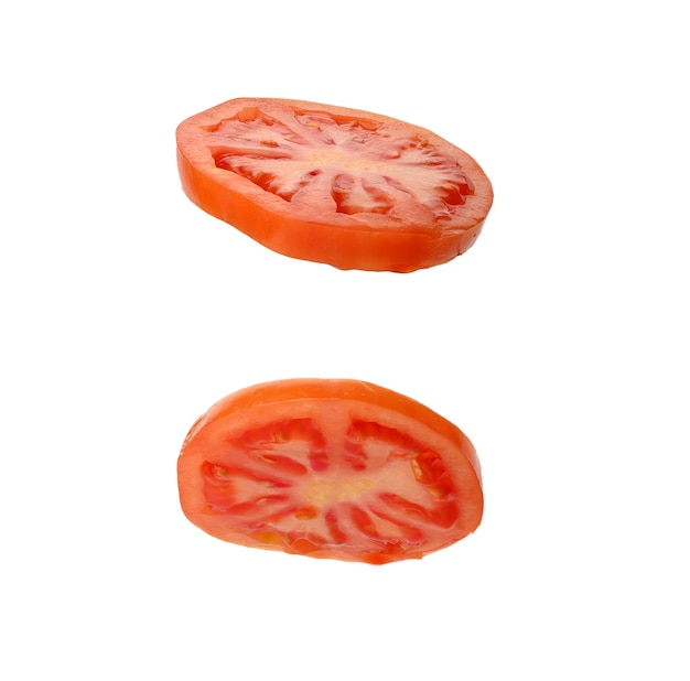 Ound slice of ripe red tomato isolated on white surface, close up