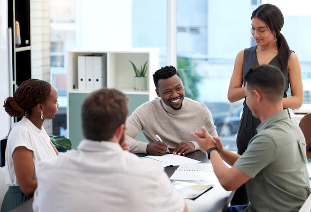 Our plans are all falling into place Shot of a group of businesspeople having a meeting in a boardroom