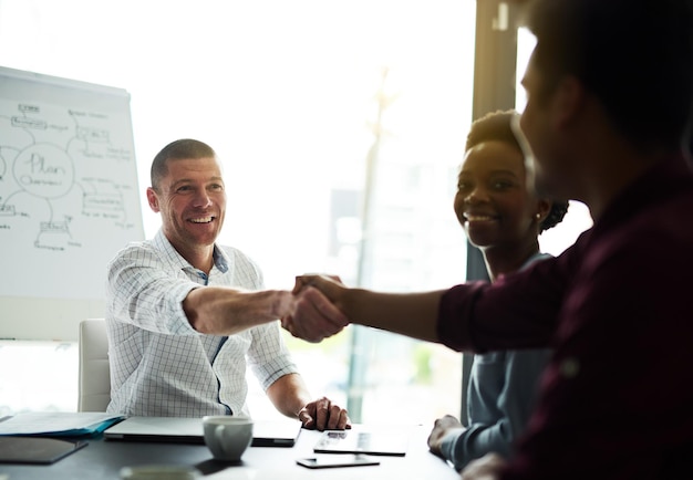 Our skills together will make for a winning combination Cropped shot of businesspeople shaking hands during a meeting in an office