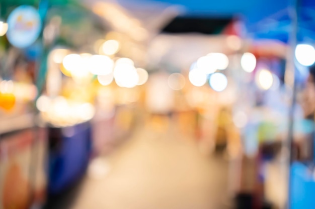 Out of focus picture of a crowd of People are shopping in the market