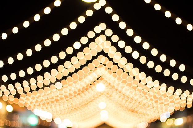 Out of focus with bokeh of light in the night of the festival.