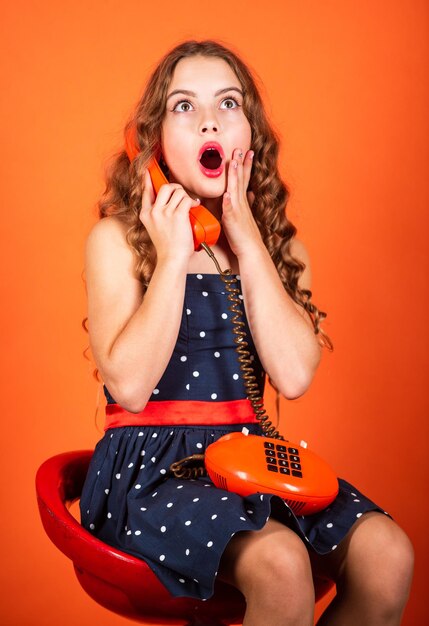 Outdated device little talker retro style communication concept\
shopping online retro girl speak phone kid talking vintage phone\
pinup girl conversation discuss gossip retro communications