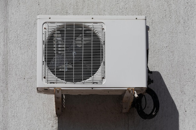 Outdoor air conditioner unit on the wall of a building