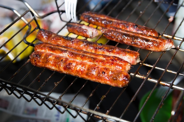 outdoor barbecue pork sausages on the grill