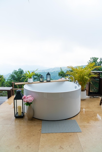 Outdoor bath tub with beautiful mountain view background