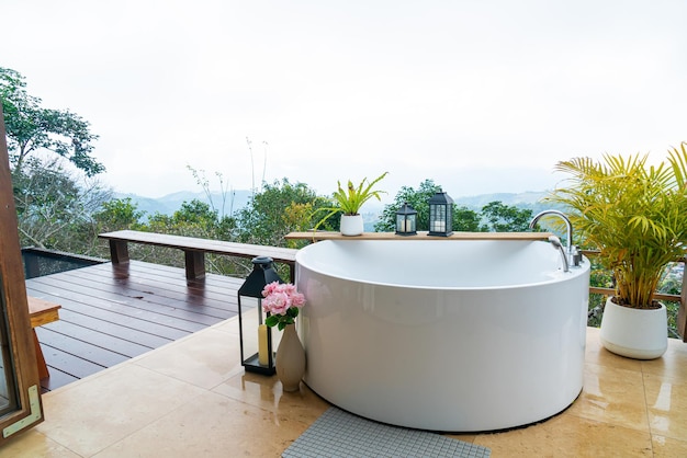 Outdoor bath tub with beautiful mountain view background