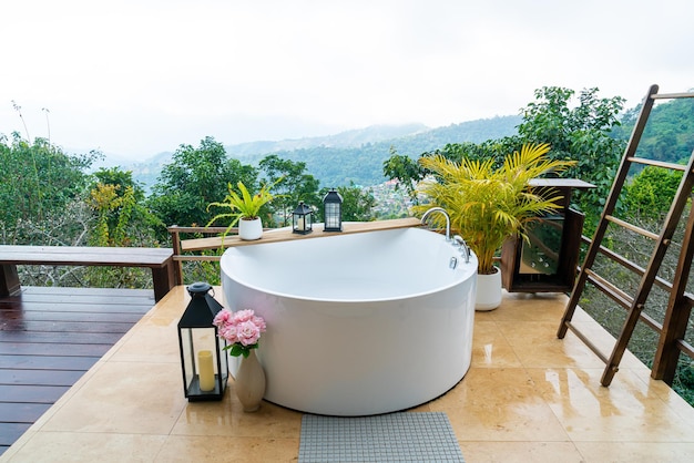 Outdoor bath tub with beautiful mountain view background