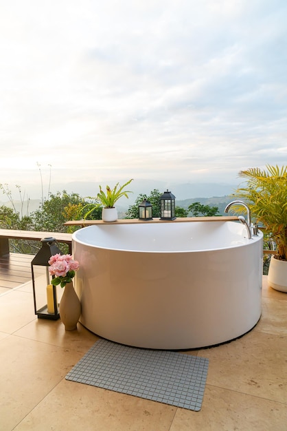 Outdoor bath tub with beautiful mountain view background