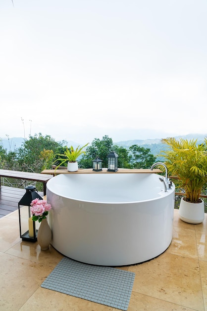 outdoor bath tub with beautiful mountain view background