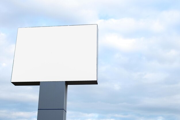 Outdoor billboard mockup on blue sky background