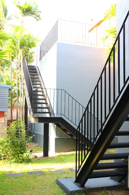 The outdoor black steel stairs install out side building abstract steel pattern