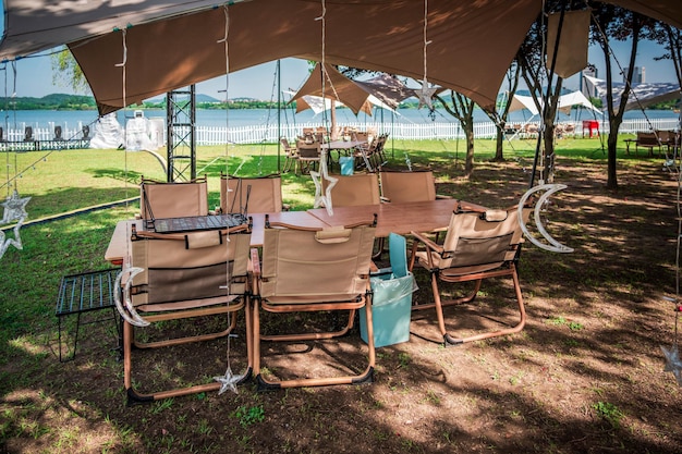 Outdoor camping tent and some tables and chairs